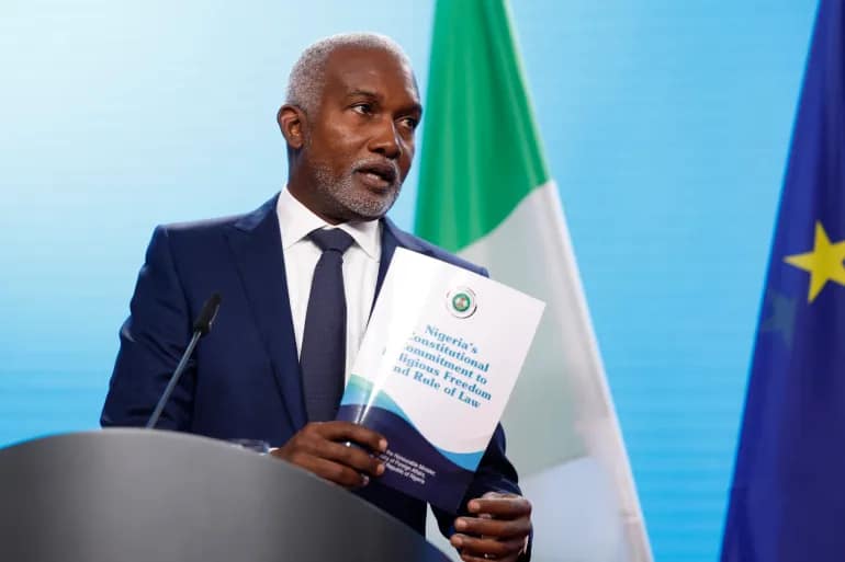 Press conference room in Abuja with reporters and cameras facing the minister’s podium.